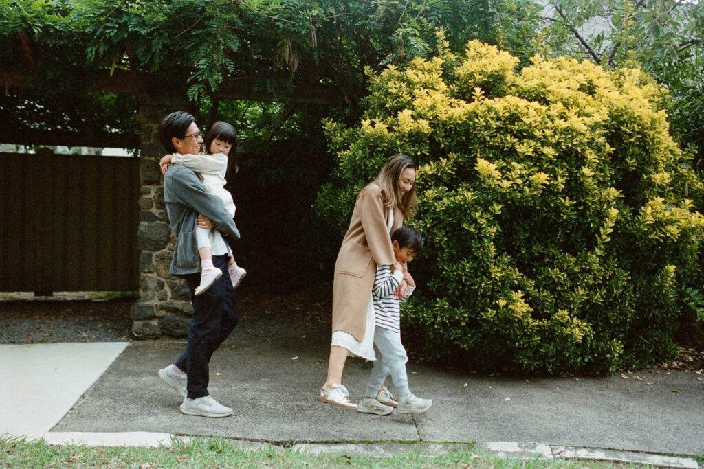 family walking together during a family photoshoot in sydney in autumn