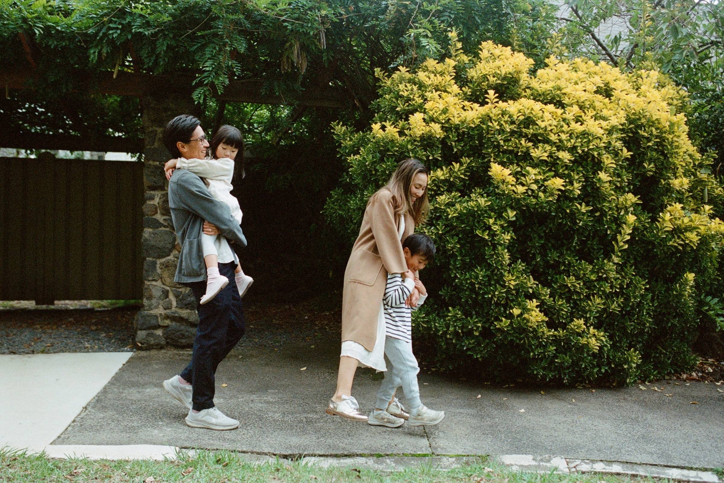 family walking together during a family photoshoot in sydney in autumn
