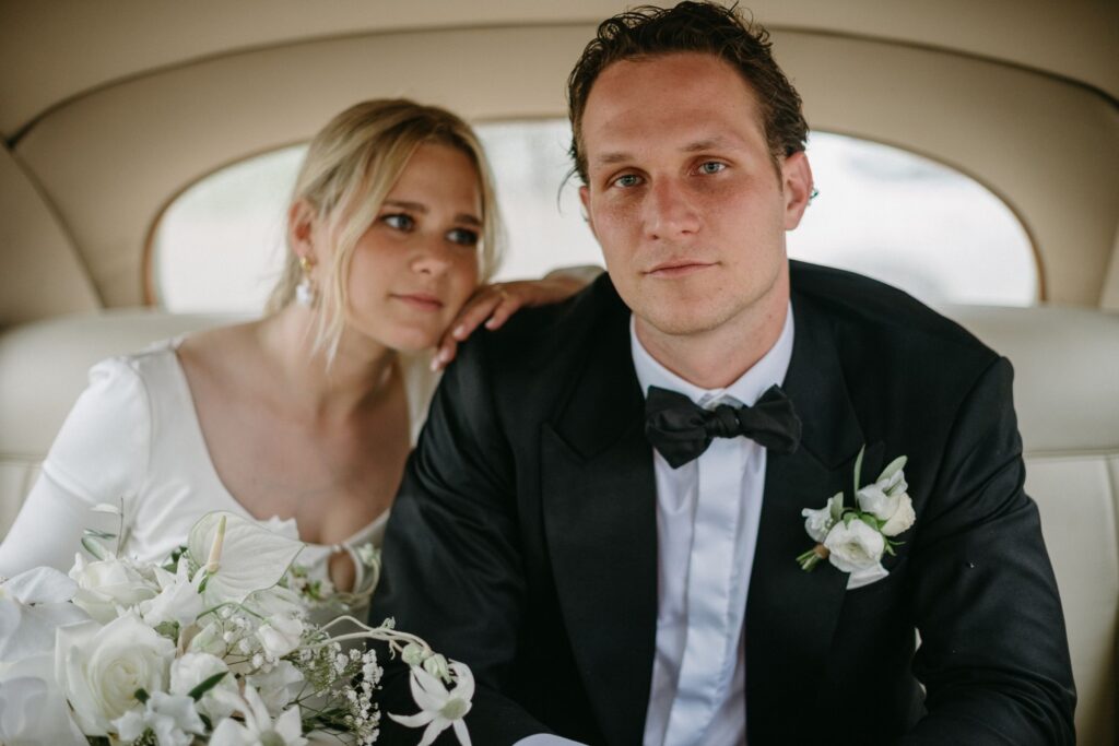 Bride resting her head on the groom's shoulder in a quiet, tender moment — candid wedding portrait by Sydney wedding photographer Tealily Photography