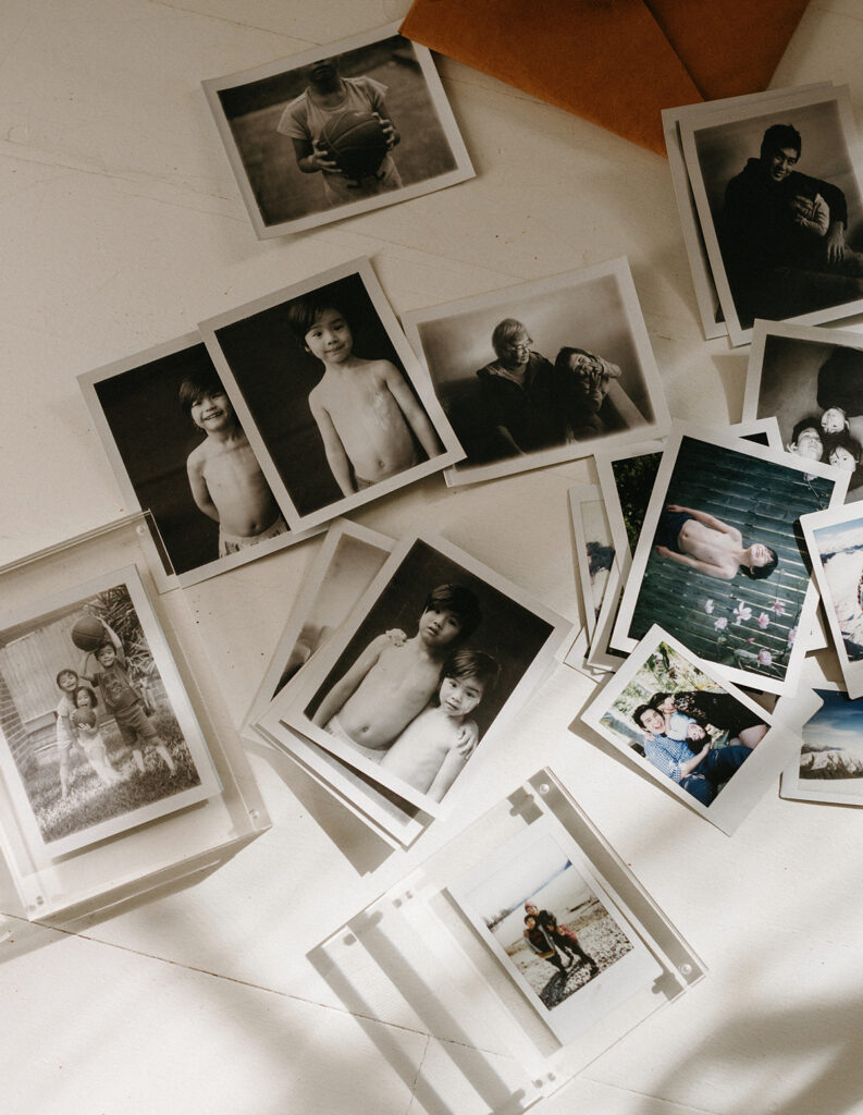 images of loose polaroid prints on the floor of kids and family